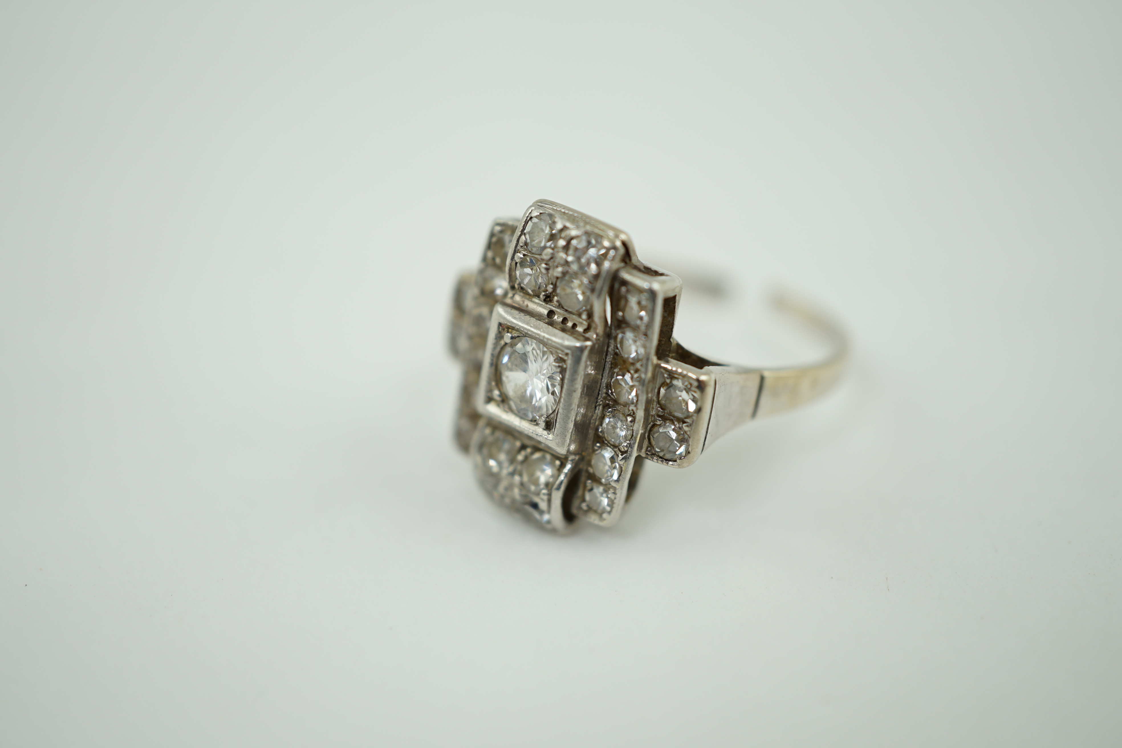 An Art Deco 18k white gold and diamond cluster set ring